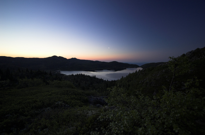 A random lake in the hills in the middle of the night